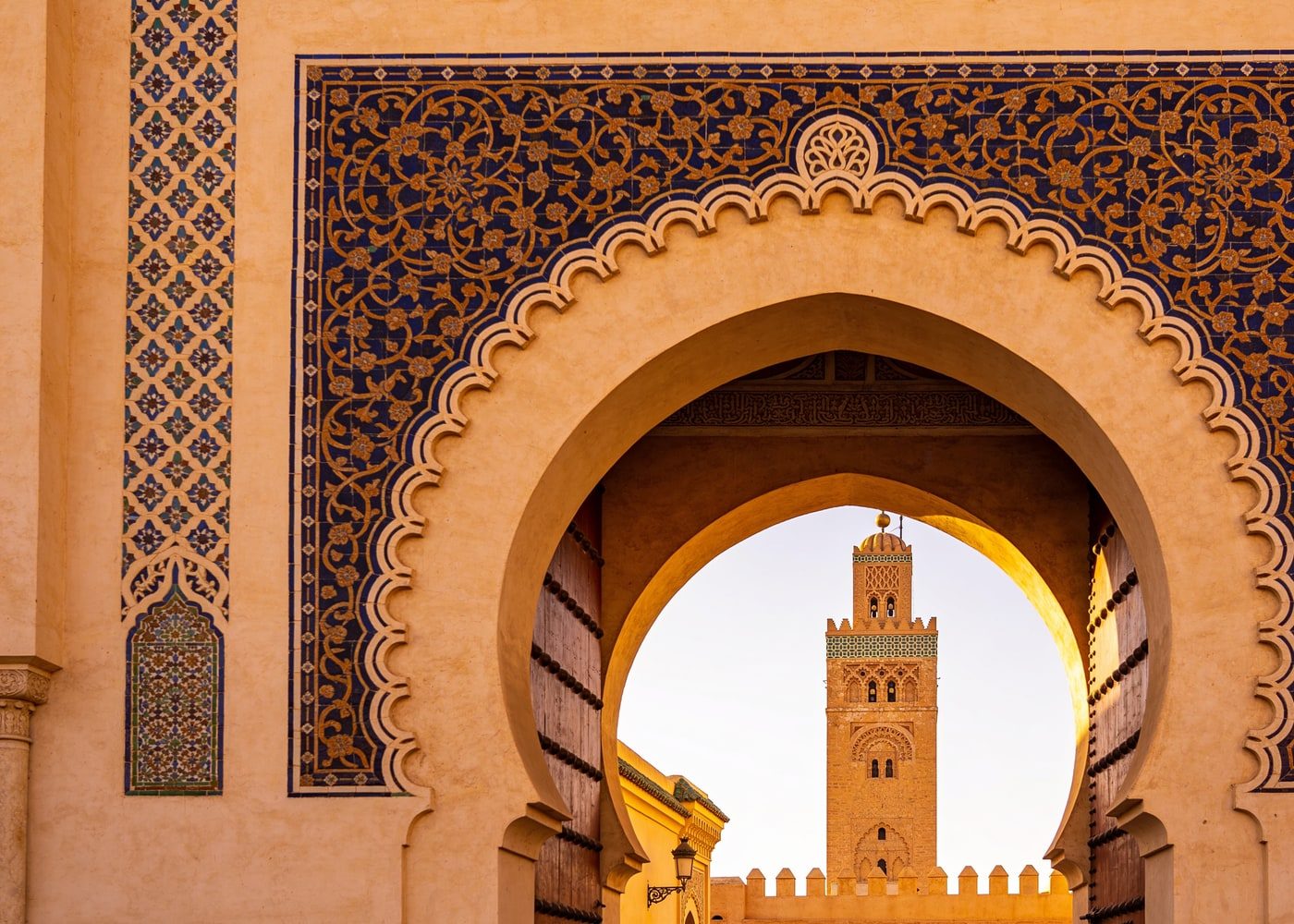 Ornate gate and minaret in an imperial Moroccan city